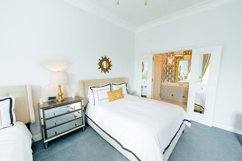 The Pedernales guest room at The William hotel features two queen-sized beds, comfortable chair and writing desk, Keurig Coffee Machine, flat screen television, and spacious bathrooms.