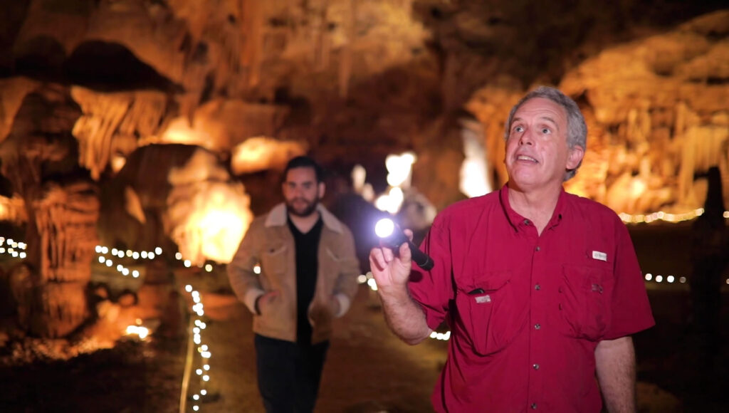 Two men exploring the caverns near Boerne, TX.