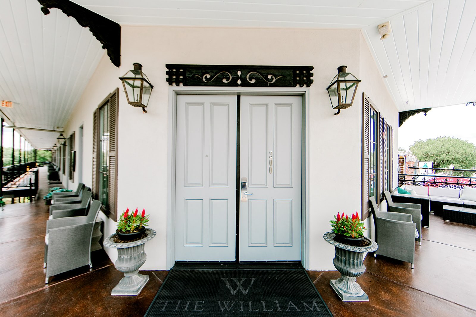 Second floor entrance to The William hotel with New Orleans-style balconies overlooking downtown Boerne, TX.